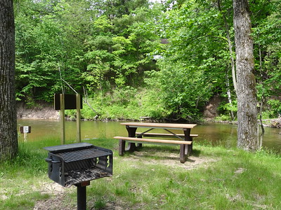 A basic campsite next to a river