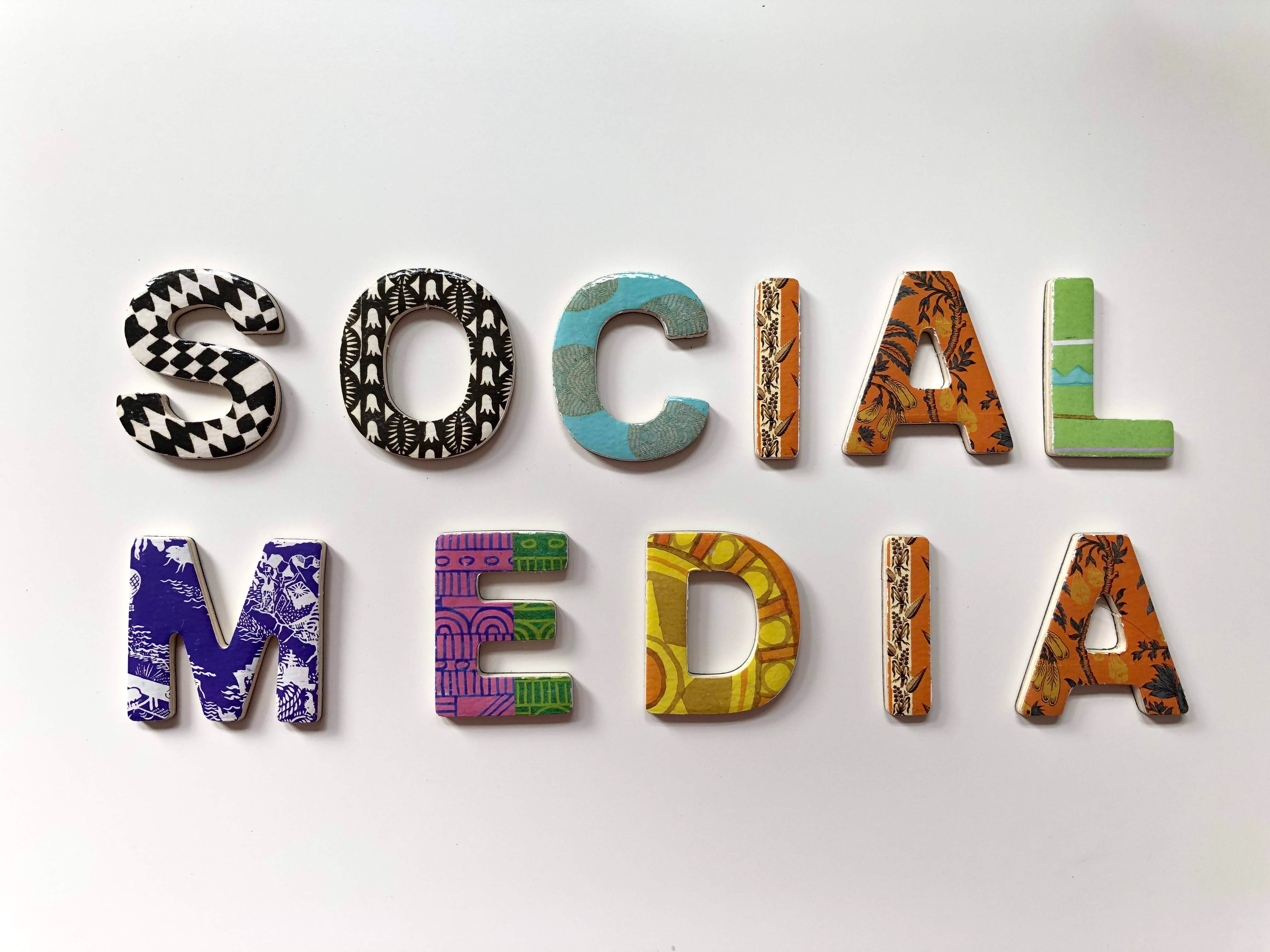 assorted color and pattern signage that reads social media